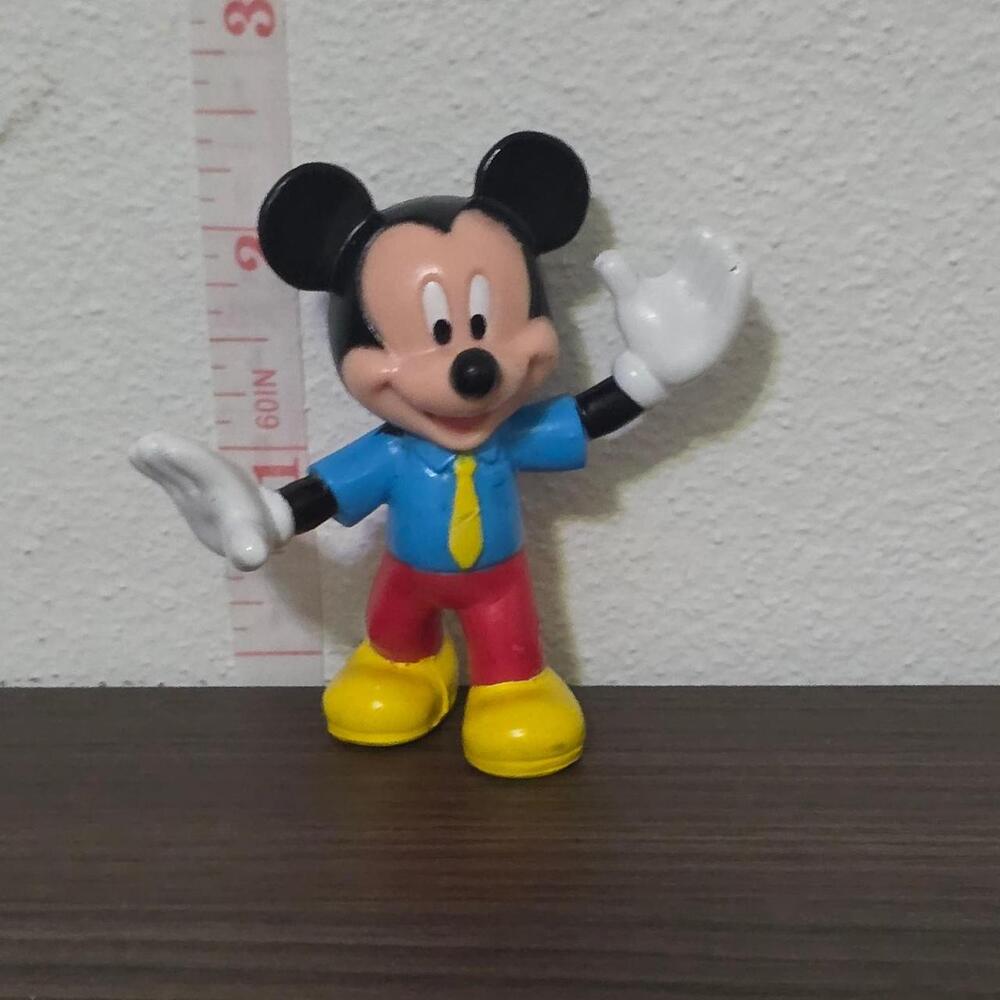 Mickey Mouse figure in blue shirt, red pants, and yellow tie #disney #mickey